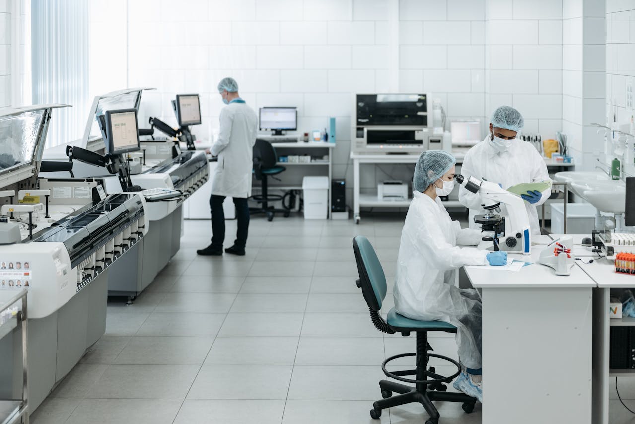 scientist working in a laboratory and discussing peptides vs proteins