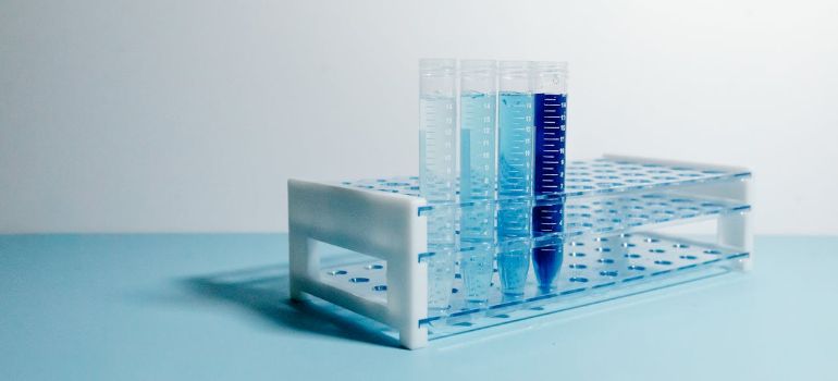 laboratory test tubes containing blue liquid samples for molecular analysis
