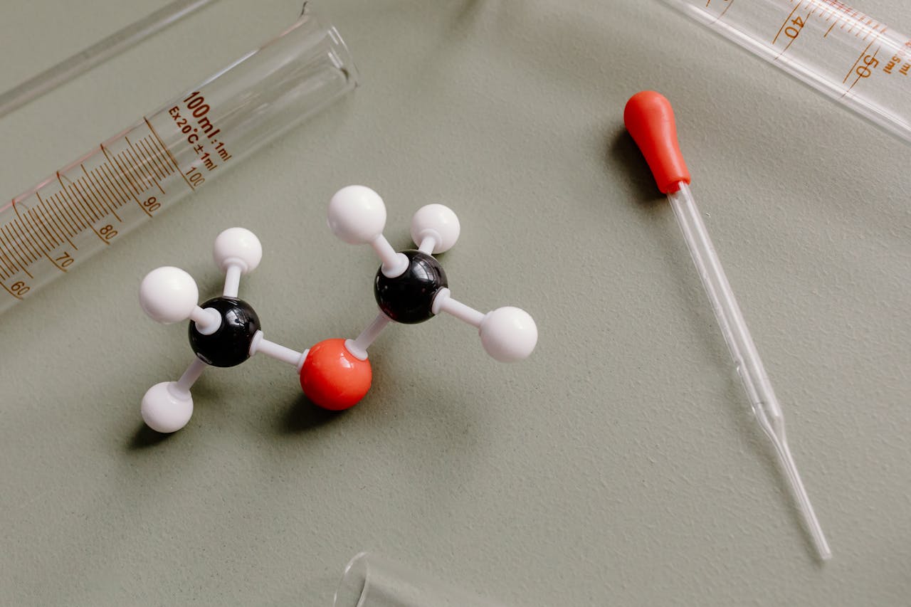 close-up of laboratory equipment and molecular model on a flat surface
