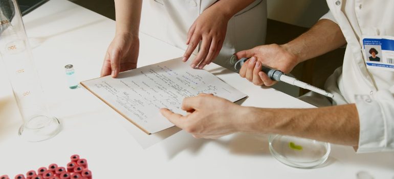 a lab technician reviewing documentation