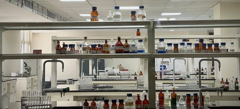 a lab bench featuring bottles and vials