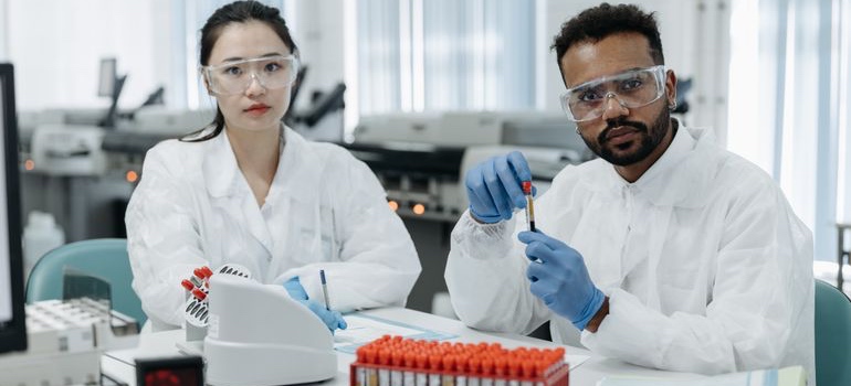 Scientists in a lab handling samples for BPC-157 no approved formulation research