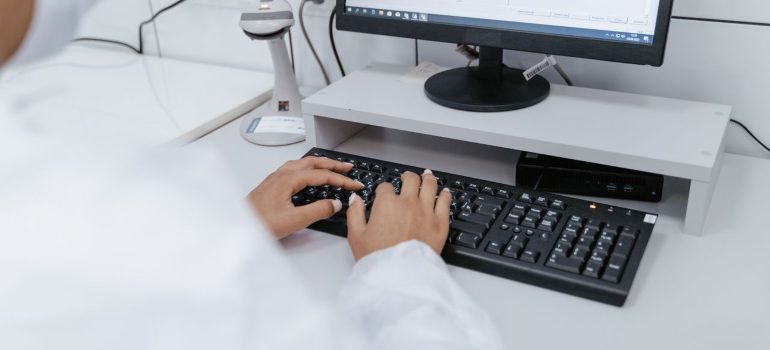 Researcher reviewing peptide half-life data on a laptop