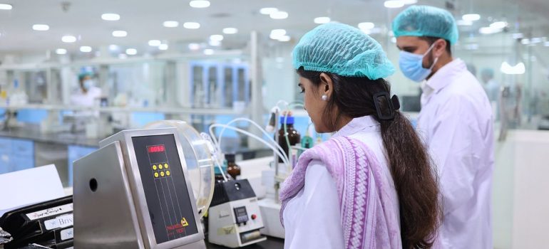 Scientists conducting tests in a pharmaceutical lab